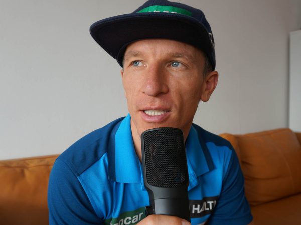 falko krismayr network marketing professional holding a microphone in front of his face.