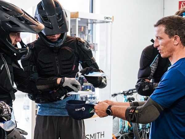 a group of men standing around each other.